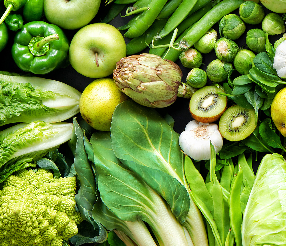 Panoramic food background with assortment of fresh organic fruits and vegetables in rainbow colors