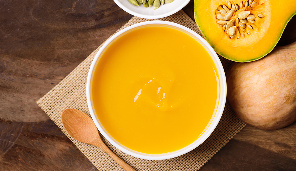 close up of fresh butternut squash soup and butternut squash from prairieland market