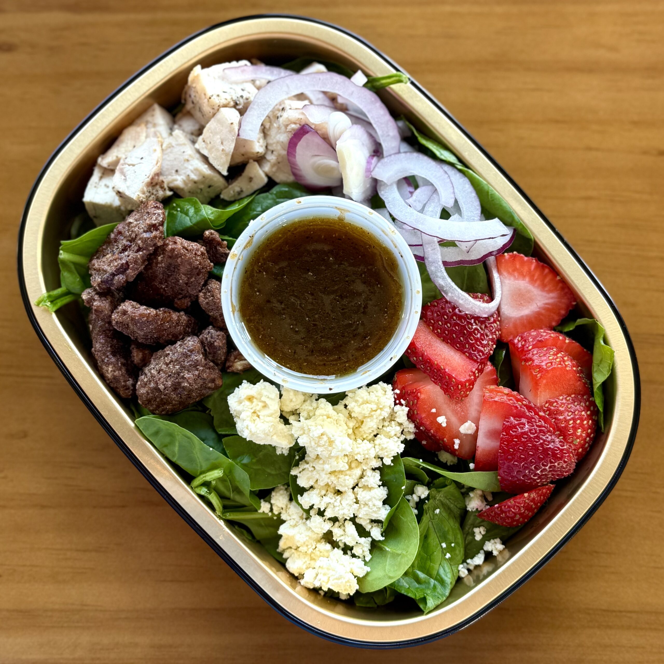 salad with chicken, strawberries, red onion, candied walnuts & feta cheese