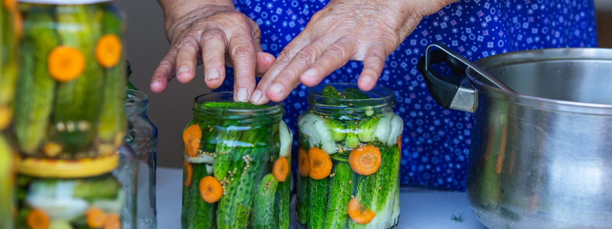 Woman demonstrating canning as one of many classes offered from Prairieland Market.