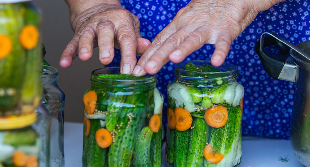 Woman demonstrating canning as one of many classes offered from Prairieland Market.