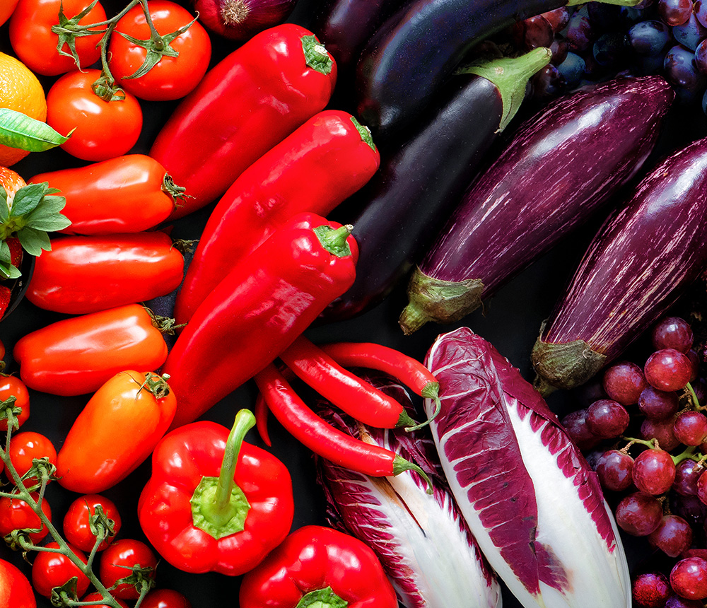 Panoramic food background with assortment of fresh organic fruits and vegetables in rainbow colors