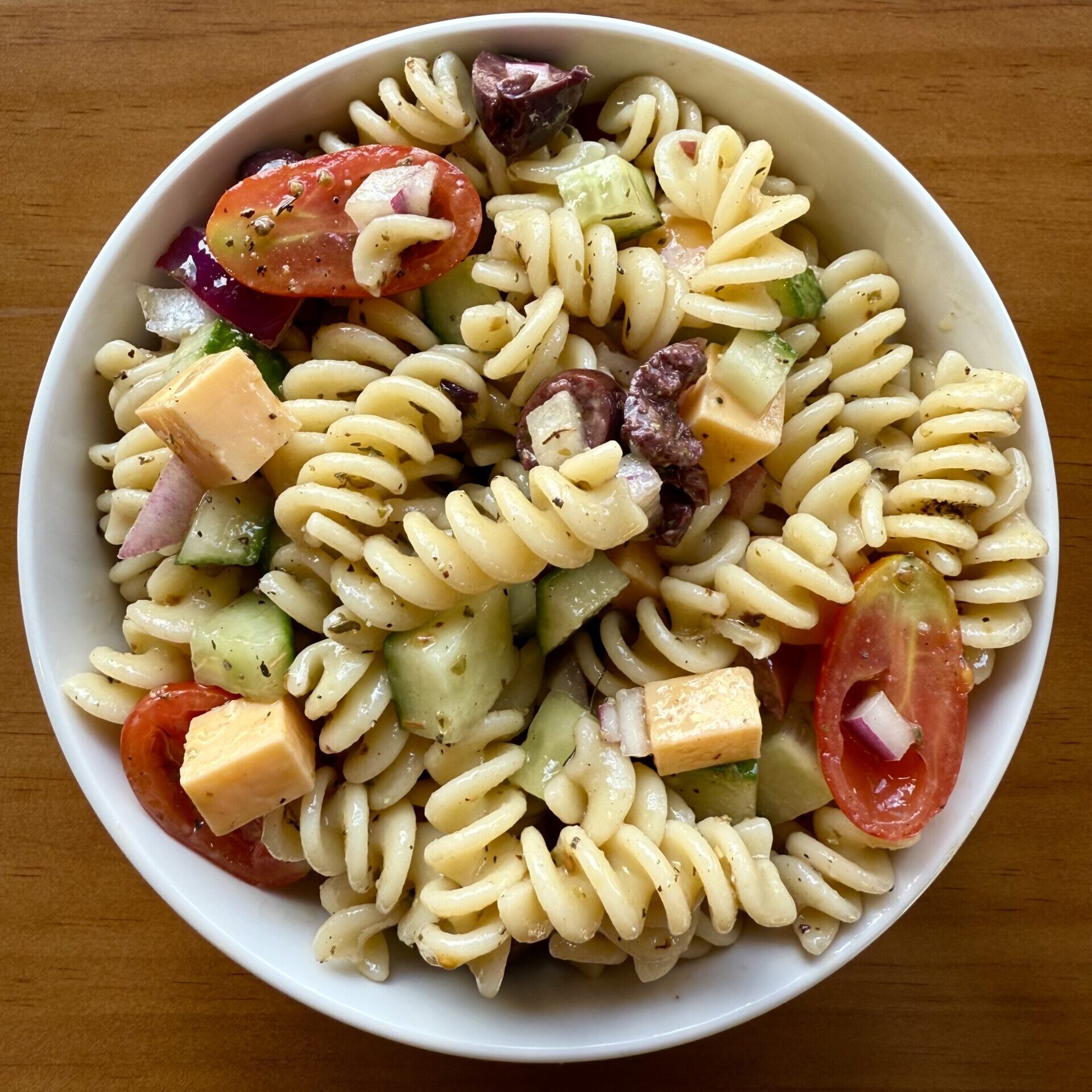 pasta salad with cheese, tomato, cucumber and olive