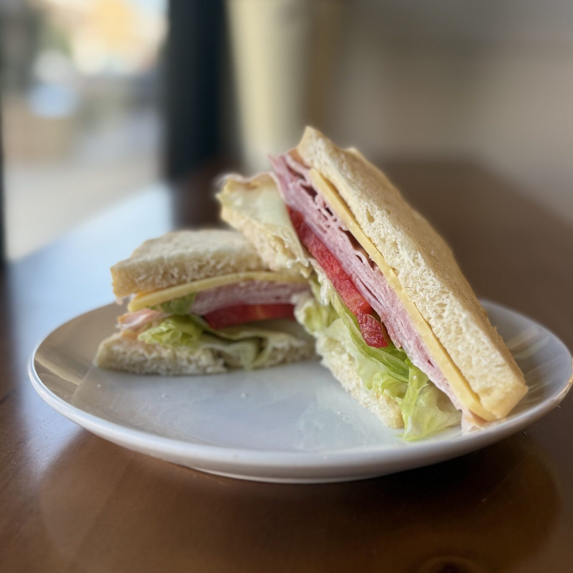 ham sandwich with cheese, lettuce and tomato