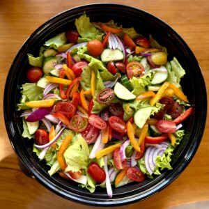 green salad with tomatoes, cucumbers, red onions and peppers