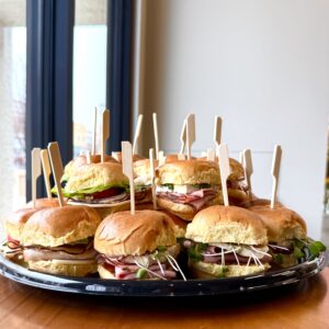 slider sandwiches with ham, turkey and vegetables