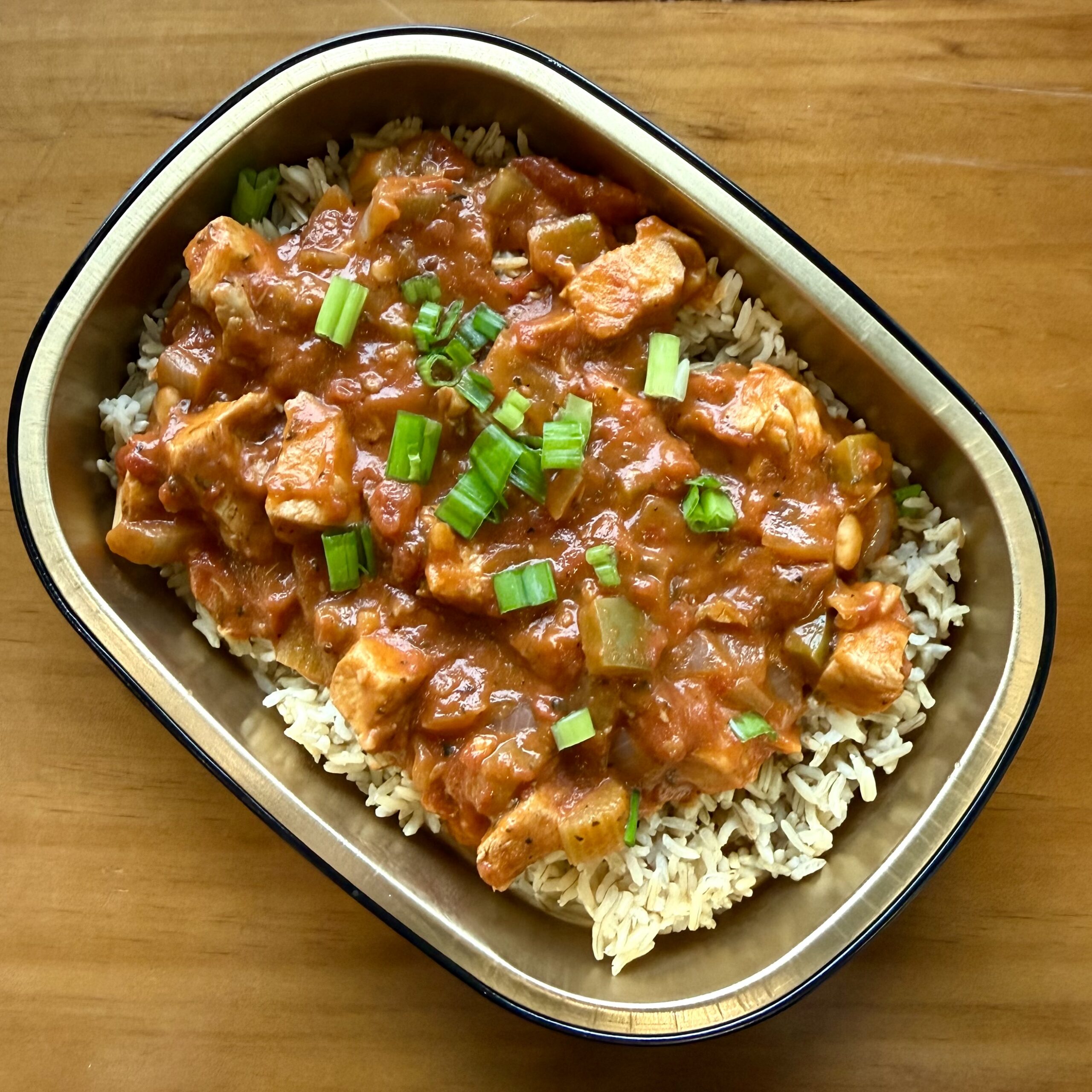 stewed chicken with tomatoes, peppers, onions and rice