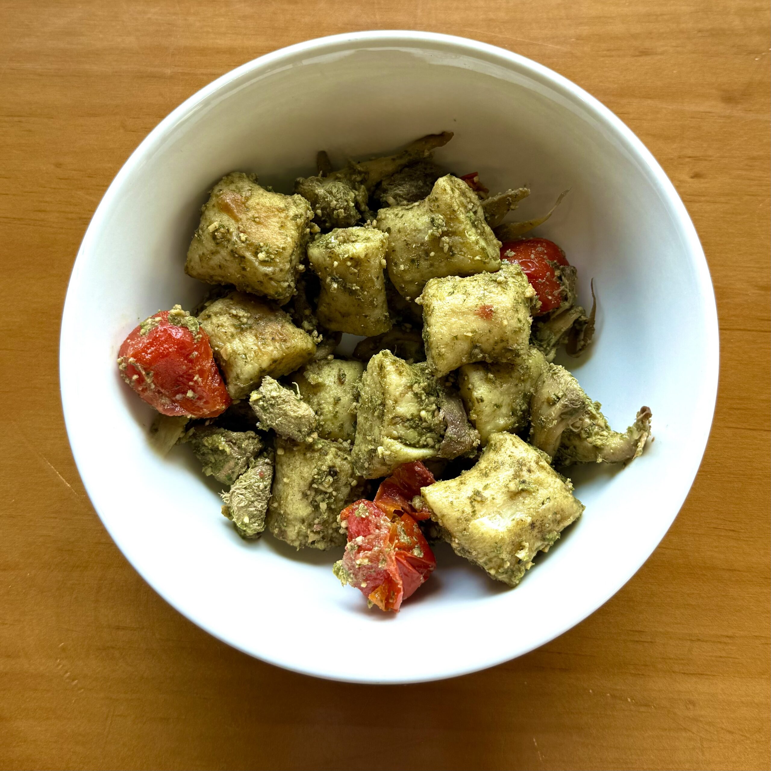 gnocchi with pesto, tomatoes and mushrooms